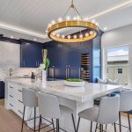 a kitchen with blue mouser cabinets