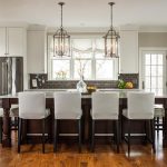 a kitchen with open windows