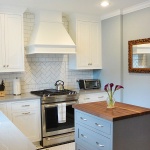 kitchen with white cabinets and an island