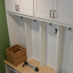 space with hooks to hang coats on a wall